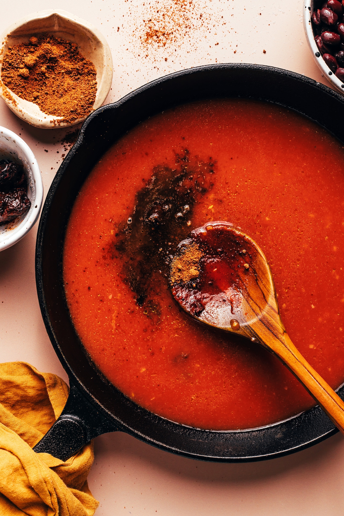 Spices in a skillet of tomato sauce
